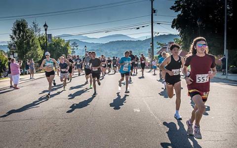 Press photo/Will Woolever - Participants stream down Main Street June 15 during Franklin’s annual Braveheart 5K benefitting the Scottish Tartans Museum. Logan Russo (far right, bib #557) of Franklin was the overall winner.