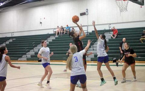Press photo/Will Woolever - Rising sophomore guard Audrey Pressley shoots over a Highlands defender in Franklin’s summer league scrimmage with their cross-county rivals June 18. 