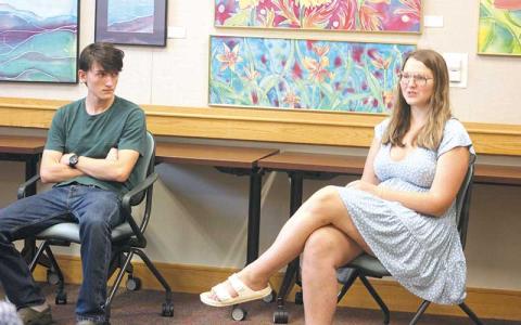 Press photo/Thomas Sherrill - Macon Early College student Daniel Pope and Foxfire peer mentor Maddie Perdue talk about the upcoming magazines at the Macon County Public Library on July 17.