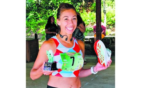 Photo submitted.  Franklin’s Kimberly Kate Jakushev shows off her First Place Overall trophy at last year’s 80s Flashback 5K. 
