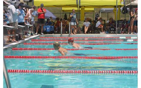 Press photo/Will Woolever - FAST’s Gabriel Ostojic (front) and Thatcher Daniels race to a close finish in the boys 13-14 100-yard breaststroke at the Mountain Swim League Championship meet July 13. 