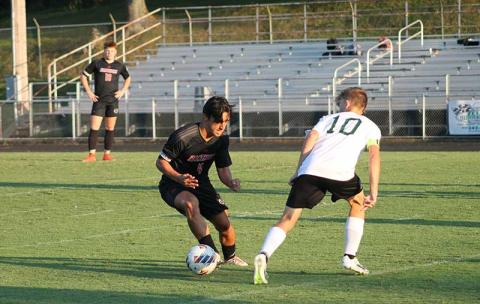 Press file photo - Senior Aaron Jennings evades an East Henderson defender at the Panther Pit last September.