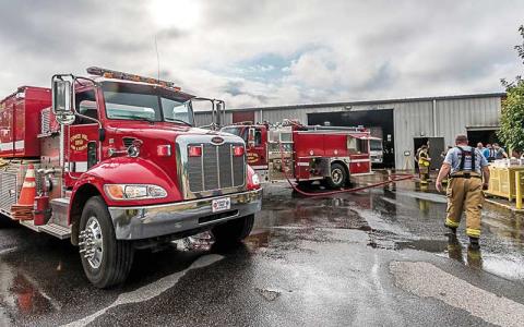 Photo/Bob Scott - Firefighters from across the county responded to the July 17 fire at Liberty Wood Products.