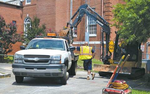 Press photo/Mia Overton - Crews from Chase Environmental Group and the Town of Franklin were working on Stewart Street Monday to remove potentially hazardous waste.