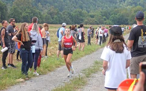 Press file photo - Then-freshman Morgan Cress nears the finish line in a meet at the Cherokee Mother Town near Ela last fall. 
