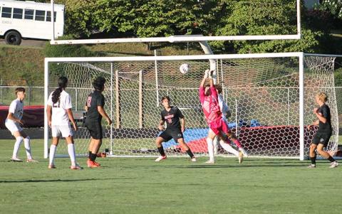 Press photo/Will Woolever - Sophomore goalkeeper Ken Modlin punches a ball from danger versus Asheville Aug. 19. 