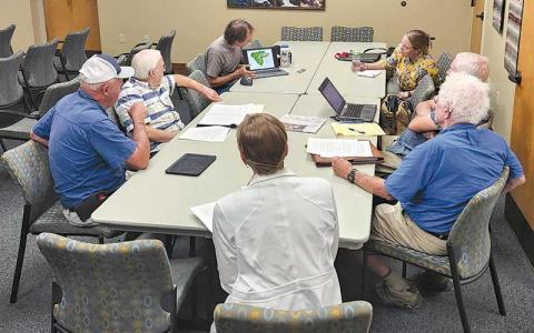 Press photo/Thomas Sherrill - Jason Love (at left with laptop computer) shares a presentation with the Water Quality Advisory Committee during an Aug. 28 meeting.