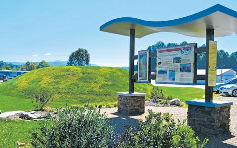 Press file photo - The Nikwasi Mound and information kiosk in East Franklin. New signs will be placed at the mound informing people about the significance of the mound and that walking on it contributes to erosion and is “inappropriate or disrespectful.”