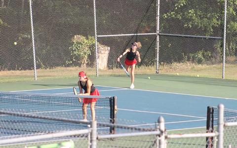 Press photo/Will Woolever - Abigail Angel (right) serves while Caroline Deal guards the net in Franklin’s #2 doubles match vs. Pisgah Aug. 26.