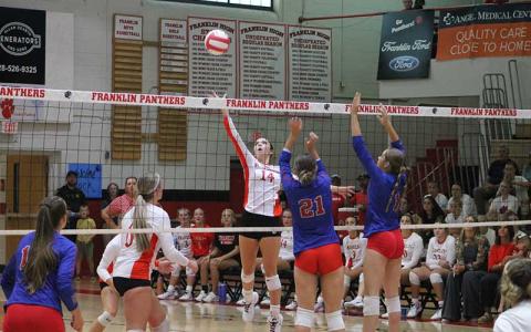 Press photo/Will Woolever - Sophomore Halle Shields lifts a ball over the net versus West Henderson Sept. 10.