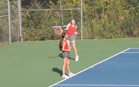 Press photo/Will Woolever - Junior Clara Stork forehands a ball versus North Henderson Aug. 28.