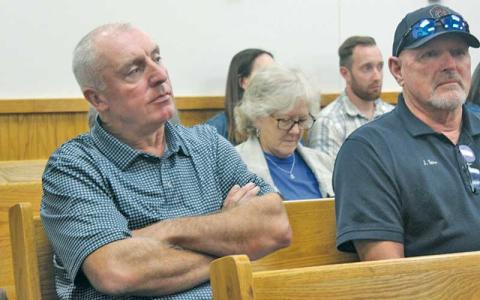 Press photos/Thomas Sherrill - Macon County Emergency Services Director Warren Cabe sitting in the crowd during the announcement of his hiring as interim county manager during the Macon County Commissioners Oct. 8 meeting.