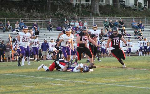 Press photo/Will Woolever - Franklin seniors Josh McGaha (center) and Caryll Cook (right) chase a loose ball following a sack-fumble from promising freshman Garrett Young (left). Cook would recover the loose ball and return it to North Henderson’s 1-yard line, where senior Braydon Hervey punched it in for a touchdown.