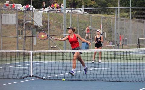 Kate Phillips volleys a ball while Abigail Angel guards the baseline in Franklin’s #1 doubles match versus East Henderson Sept. 16. (Press file photo)