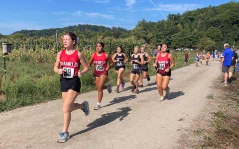 Photo courtesy of Kimberly Timan - (From left) Maddie Holden, Alexa Morales and Nadia Owle traverse the site of the Cherokee Mother Town at Kituwah in the Keith Payne Memorial Invitational Sept. 21.