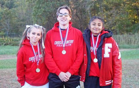 Press photo/Will Woolever - Franklin’s top distance runners are pictured with their All-Conference medals at the Mountain Seven Championship meet in Canton Oct. 16. From left are Morgan Cress, Matheson Post and Amy Mendoza Lopez.