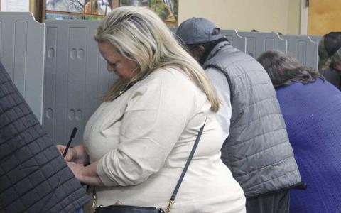 Press photo/Thomas Sherrill - Amanda Watson votes at the North Franklin precinct around 9 a.m. on Election Day, Tuesday, Nov. 5. Watson and others said it felt great to cast their ballot and that everyone at the precinct was so friendly.