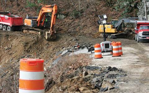 Photo/Ryan Hanchett - A crew from Bryson Grading and Paving has started the work to repair NC 106 and hope to have the road ready for travel sometime in January.