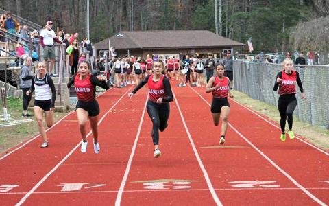 Press photo/Will Woolever - Four of Franklin’s top female sprinters run the 55-meter dash at Swain County High School Nov. 20. From left are Michelle Ortega, Laura Covarrubias, Kai Pelletier and Anna Timan. 