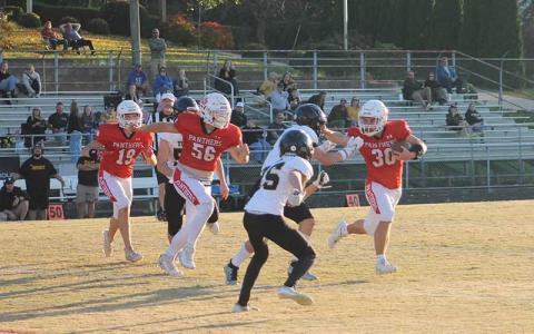 Press photo/Will Woolever - Freshman Swiss army knife Paxton Sutton stiffarms a Tuscola defender at the Panther Pit Oct. 28.