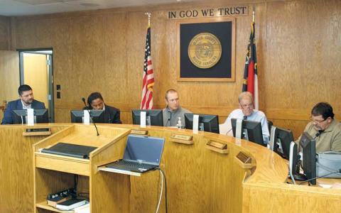 Press photo/Thomas Sherrill - Macon County Commissioners (from left) Barry Breeden, Danny Antoine, Josh Young, Gary Shields and John Shearl at the Dec. 2 meeting.