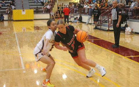 Senior guard McKenna Plemmons drives to the rim at Cherokee Nov. 26. (Press file photo)