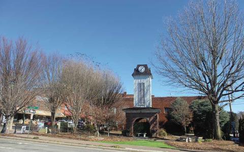 Press photo/Thomas Sherrill - Some of the trees around the clock tower square will soon be cut down because they are creating hazards. The work will be part of the overall improvements to the clock tower and surrounding area.