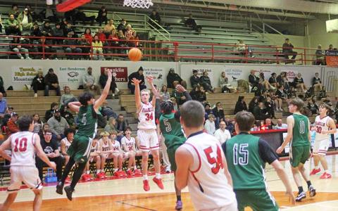 Press photo/Will Woolever - Freshman Brock Holland attempts a jump shot versus East Henderson on Tom Raby Court Jan. 21. 