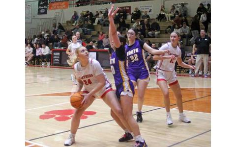 Senior Payton Baty weighs a contested shot versus North Henderson Jan. 7. (Press photo/Will Woolever)