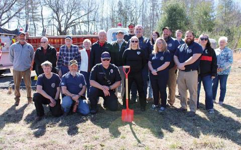 Press photo/Vickie Carpenter - Otto Volunteer Fire and Rescue members, past and present, celebrate the start of construction of a new firehouse at 8249 Georgia Road, on Monday, Feb. 24.