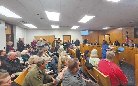 Photo by Thomas Sherrill - A packed house listens to Joanne Rosner speaking to the Macon County Board of Commissioners at the Feb. 11 meeting.