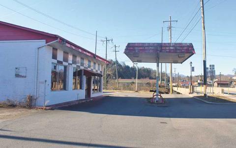 Press file photo - The Macon County Board of Commissioners rejected two more bids on the old Gulf station in East Franklin. It was suggested the county keep the building and possibly use it for office space.