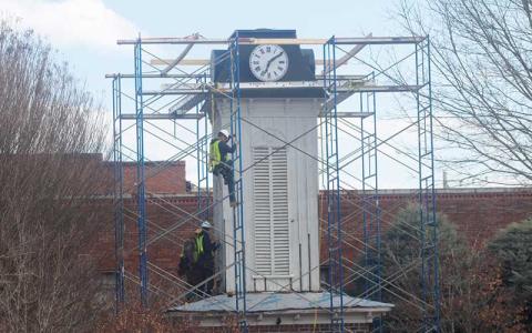 Press photo/Thomas Sherrill - Workers make repairs to the Clock Tower in downtown Franklin on Friday, Feb. 7.
