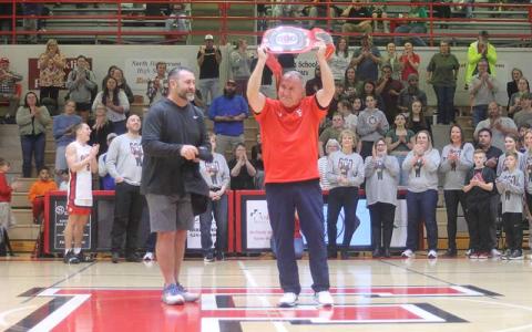 Press photo/Will Woolever - Panther men’s varsity basketball head coach Doug Plemmons recieves a championship wrestling-style belt emblazoned with the number 600 in honor of his 600th career win, which he recorded Jan. 31 at North Henderson. 