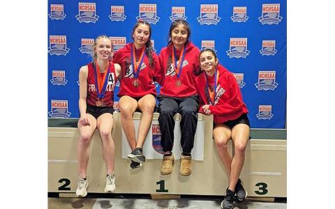 Photo courtesy of Melissa Ward - Franklin’s women’s 4x400-meter relay team is pictured with their third-place medals at the 3A state meet in Winston-Salem Feb. 15. From left are Anna Timan, Michelle Ortega, Amy Mendoza Lopez and Laura Covarrubias. 