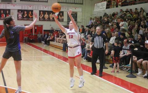 Senior McKenna Plemmons attempts a 3-point shot versus Smoky Mountain on Tom Raby Court Feb. 4. The guard broke a program single-game record with eight 3-pointers at West Henderson Feb. 7. 