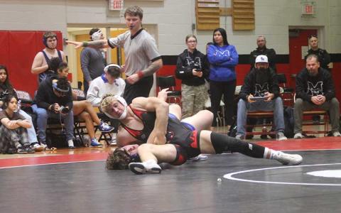 Press photo/Will Woolever - Freshman Garrett Young battles a wrestler from Smoky Mountain on Tom Raby Court Jan. 15. 