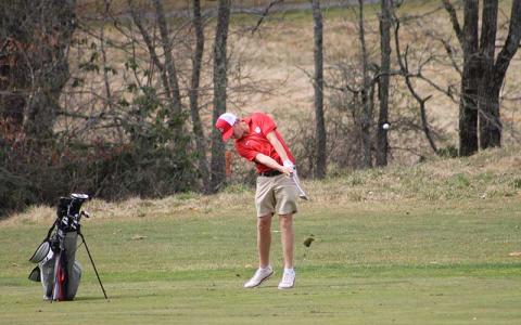 Senior Cole Martin hits an approach shot toward the third green at Sky Valley Golf Club March 13 (Press photo/Will Woolever)