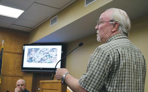 Press photo/Mia Overton - Alpine Cottages resident Ted Pitcher addresses the Franklin Town Council about the community’s $9,000 water bill after a leak in the development’s water system.
