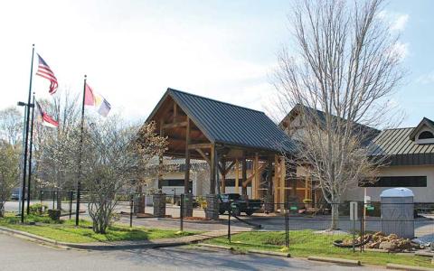 Press photo/Shelby Powell - Repairs continue at the entrance to the Macon County Public Library.