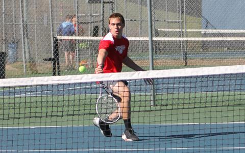 Press photo/Will Woolever. Senior Gavin Rinker hits a groundstroke versus Tuscola March 26. 