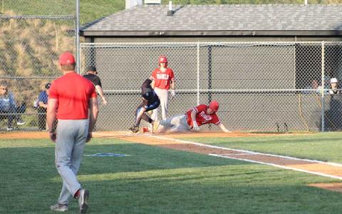 Press photo/Will Woolever - Junior Addix Sutton slides safely into home plate during Franklin’s 12-run win at Smoky Mountain April 1. 
