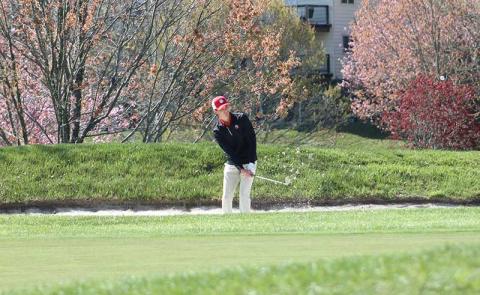 Press photo/Will Woolever - Senior Gabe Stilwell chips out of a bunker on Hole 9 at Sky Valley Country Club April 9. 
