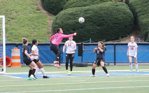 Junior goalkeeper Carramia Ramos punches a ball from danger at Smoky Mountain March 31. (Press photos/Will Woolever)