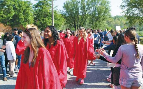 Press photo/Shelby Powell - Franklin High School students are greeted at Macon Middle School during the annual Grad Walk.
