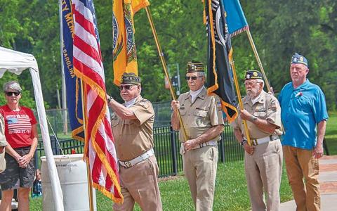 Photo/Bob Scott - Members of the American Legion and Veterans of Foreign Wars Honor Guard present the colors. 