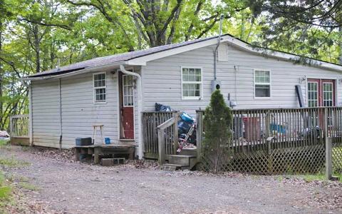 Press photo/Mia Overton - The Town Council voted unanimously Monday night to order that this house and property at 7 Cat Creek Estates be vacated and closed due to violations of the Minimum Housing Code. The owner also owes $3,736.21 in taxes, which have not been paid since 2017.
