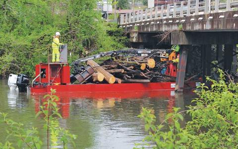 Press photo/Shelby Powell - Contractors for the U.S. Army Corps of Engineers remove debris along the section of the Little Tennessee River in East Franklin.