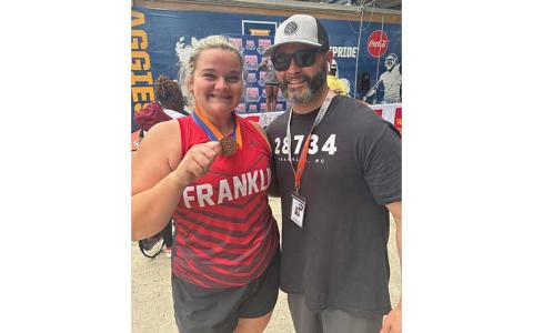 Photo submitted - Senior Charley Seagle shows off her bronze medal in the shot put with FHS principal Blair King.