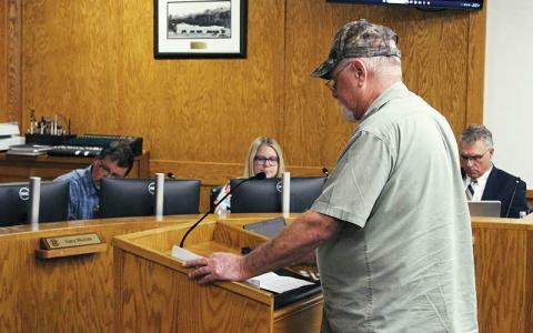 Press photos/Shelby Powell - Cullasaja resident Don Willis speaks to the county commissioners, advocating for a one-cent tax increase for the fire district.